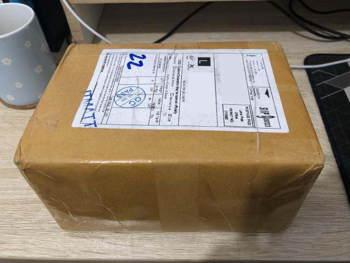 AirGradient package that looks manually packaged by hand and sent from Thailand.